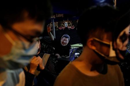 Protesters join Halloween party goers in HK bar district