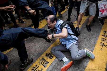 HK students arm themselves with bows and arrows, catapults