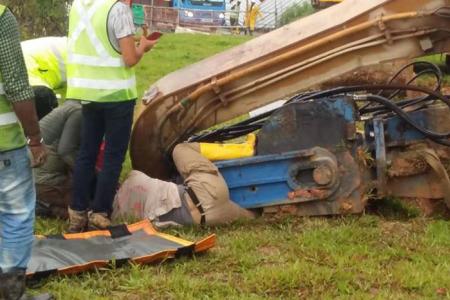 Worker rescued after excavator topples and traps his left leg