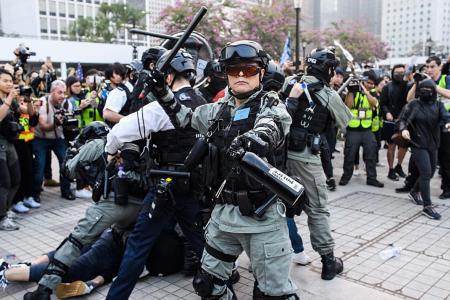 Rally for Uighurs turns chaotic as HK cops clash with protesters