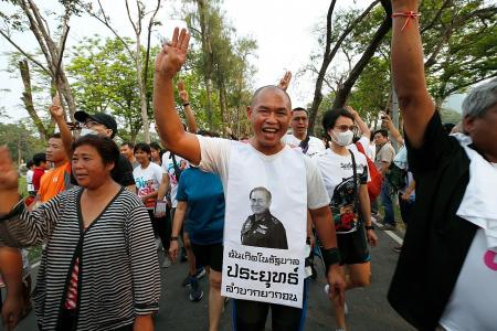 Thousands join Thai anti-government run while rival camp pushes back 
