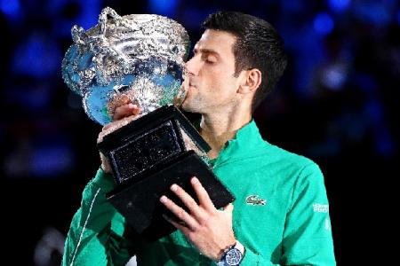 Dizzy, dehydrated Djokovic downs Thiem to win eighth Australian Open