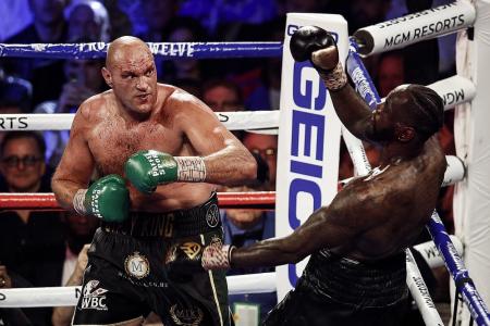 King Tyson subjects Deontay Wilder to fist of Fury 