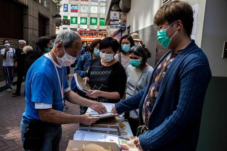 HK to give big cash handouts as economy reels from virus 