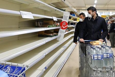 UK supermarkets limit purchases as shoppers step up panic buying