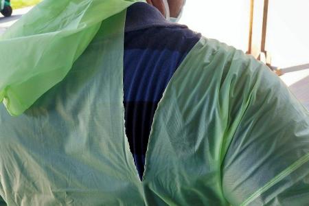 Indian doctors fight coronavirus with raincoats, helmets amid shortage