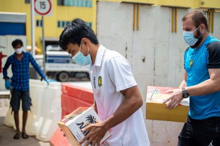 Tampines Rovers deliver 100kg of dates to foreign workers, community