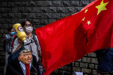 China media, Hong Kong lash out at Trump’s threat of curbs