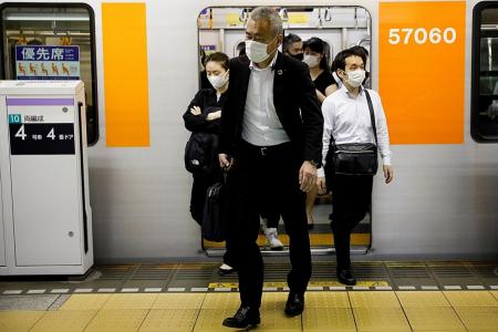 Japan’s ‘mosh pit’ trains raise fears of resurgence in infections