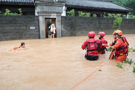 Dozens killed or missing as south China hit by storms and floods