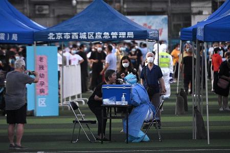 China reports highest daily number of coronavirus cases in months