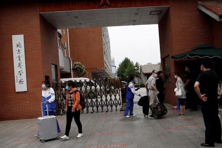 Beijing cancels flights, shuts schools as coronavirus cases jump