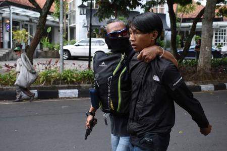 Indonesian cops detain nearly 400 as protests turn violent