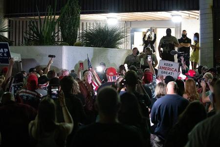 Trump supporters protest outside Arizona vote centre, some are armed