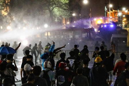 Thai police use water cannon against thousands of protesters 
