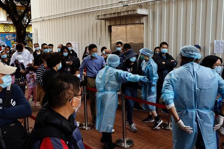 Hong Kong tightens virus curbs, cuts meetups to two people