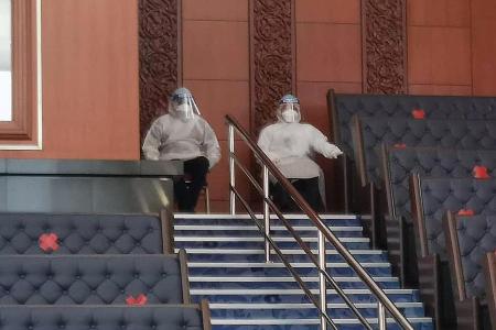 Quarantined ministers enter Malaysia Parliament, opposition walks out