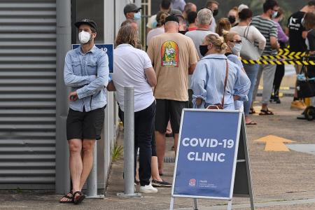 Officials rush to trace source of Covid cluster as Sydney cases rise
