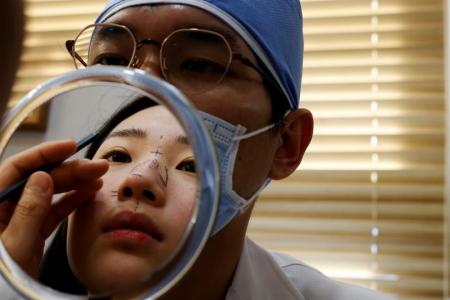 As end to mask-wearing nears, Koreans flock to cosmetic surgery 