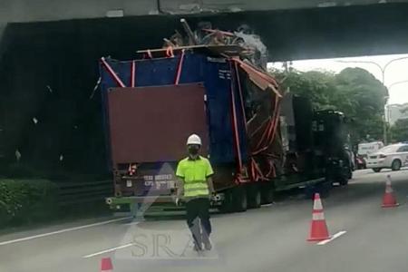 Trailer with cargo stacked too high hits underside of Clementi Flyover