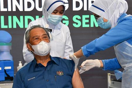 Malaysian PM vaccinated but not safe from political fallout