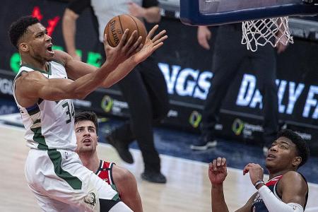 Giannis Antetokounmpo shines for Bucks in day of triple-doubles