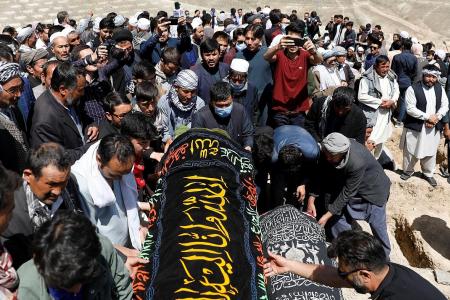 Dozens of girls buried after blast outside school in Afghanistan