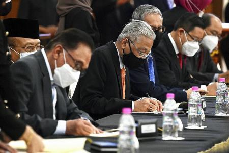 Malaysia&#039;s PM Ismail signs cooperation pact with opposition 