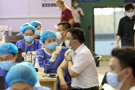 China fully vaccinates more than 1 billion as Fujian battles Covid-19