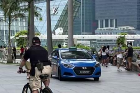 Cabby warned for driving on MBS pedestrian walkway