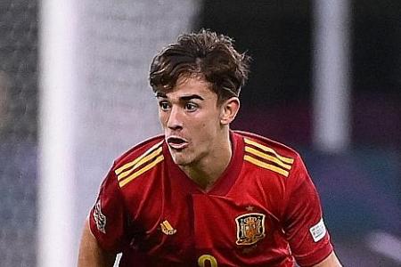 Savvy Gavi, 17, shines on record-breaking Spain debut
