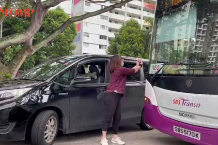 Woman blocks bus with her car, scolds driver for not giving way