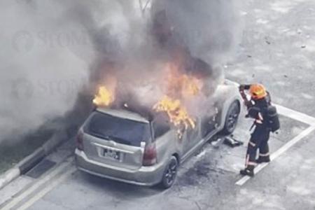 Car bursts into flames at Yishun junction, leaves one person with minor injuries