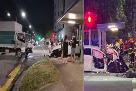 Lorry collides with Mercedes outside Geylang police centre, driver arrested