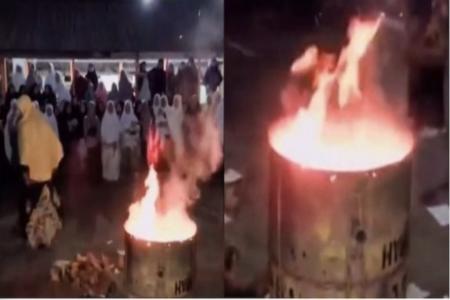 Teachers filmed burning students' mobile phones in backyard bonfire