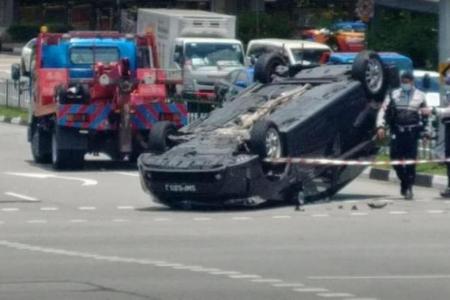Three people hospitalised after accident leaves car overturned in Bukit Panjang