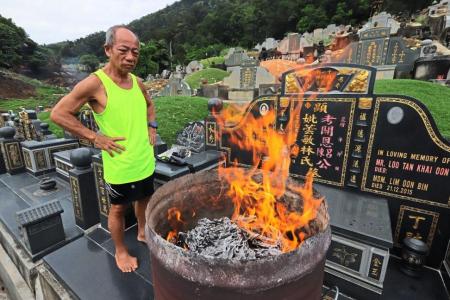 Rain or shine, Malaysian man visits his wife's grave every day