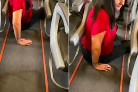 Jetstar passenger crawls down plane aisle after she's allegedly told to pay for wheelchair