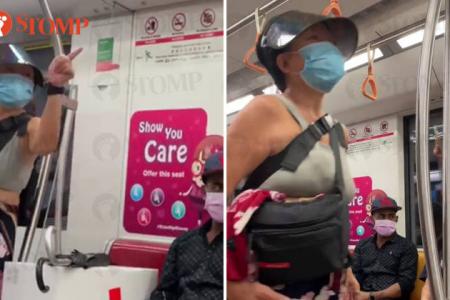 Woman curses man for not wearing a mask properly in the MRT