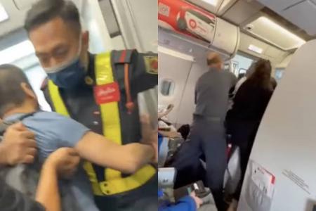 Malaysian family say they were kicked off overbooked AirAsia flight after boarding pass confusion