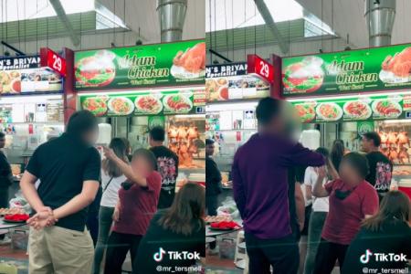 Hawker yells at man in queue at Ayer Rajah Food Centre as diners look on amused