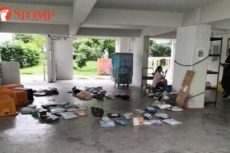 Resident upset with delivery woman for sorting parcels at void deck