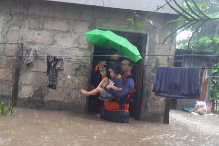 Philippines floods force tens of thousands to flee homes