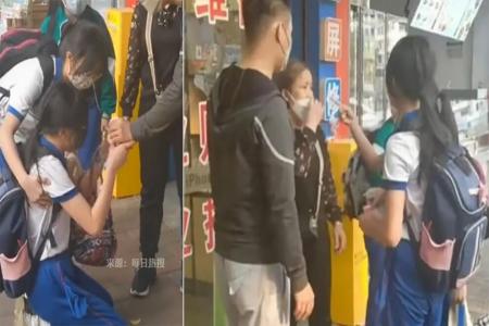 Girl in China begs and screams for woman to return $40 she dropped on the street
