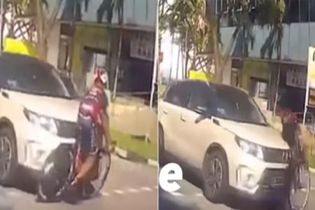 Cyclist gets hit by car after brazenly cutting across moving traffic in Clementi