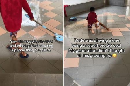 Carefree boy captures hearts with void deck ‘water slide’