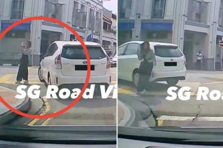 Car hits woman taking photo on road in Tanjong Pagar