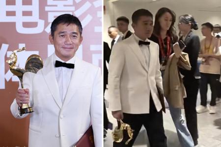 Actor Tony Leung upsets Chinese netizens by holding Golden Rooster Award upside down backstage