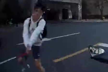 Korean teen takes a swing at passing deliveryman 