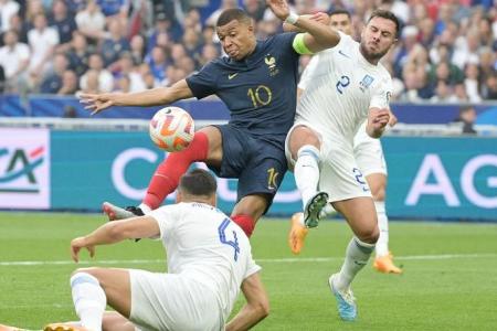 Record Mbappe leads France to another Euro qualifier win against 10-man Greece